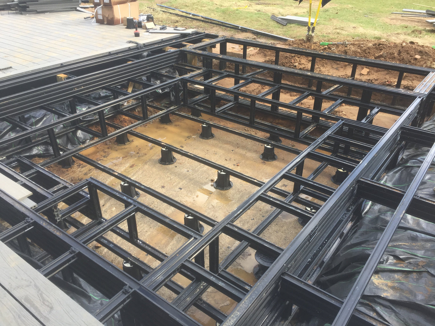 Adjustable decking frame pedestals