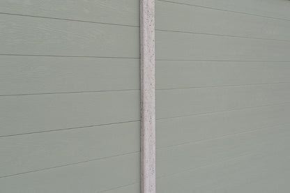 Close-up of a olive grey paneled fence panel in concrete post